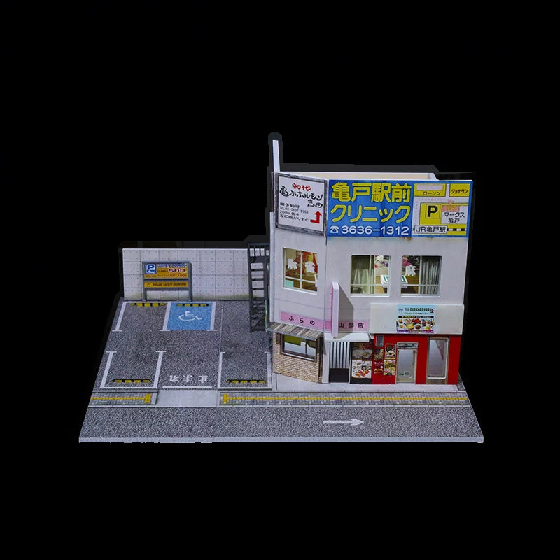 The 1:64 Japanese shop building scene on its own, its marked parking lot empty with no cars or figures