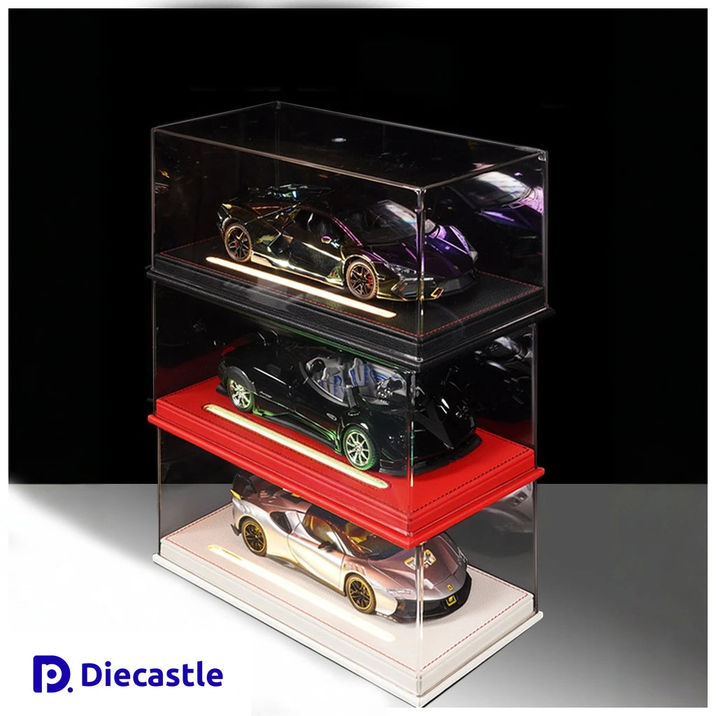 Three model cars in a transparent display case with Diecastle branding.