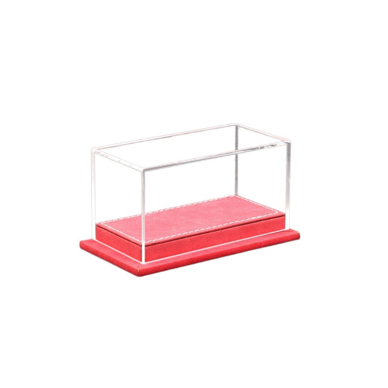 Clear display case with a red base on a white background