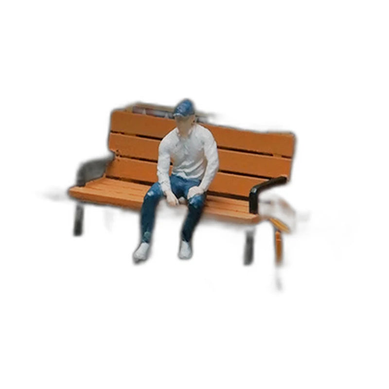 1:64 Miniature Figures – 50 People, Animals & Props, Seated Man – Flat Cap base
